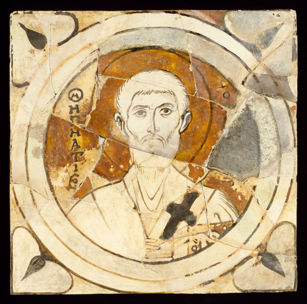 Byzantine ceramic tile depicting St. Ignatius the God-Bearer (Theophorus) of Antioch, with a golden halo and episcopal vestments, holding a cross
