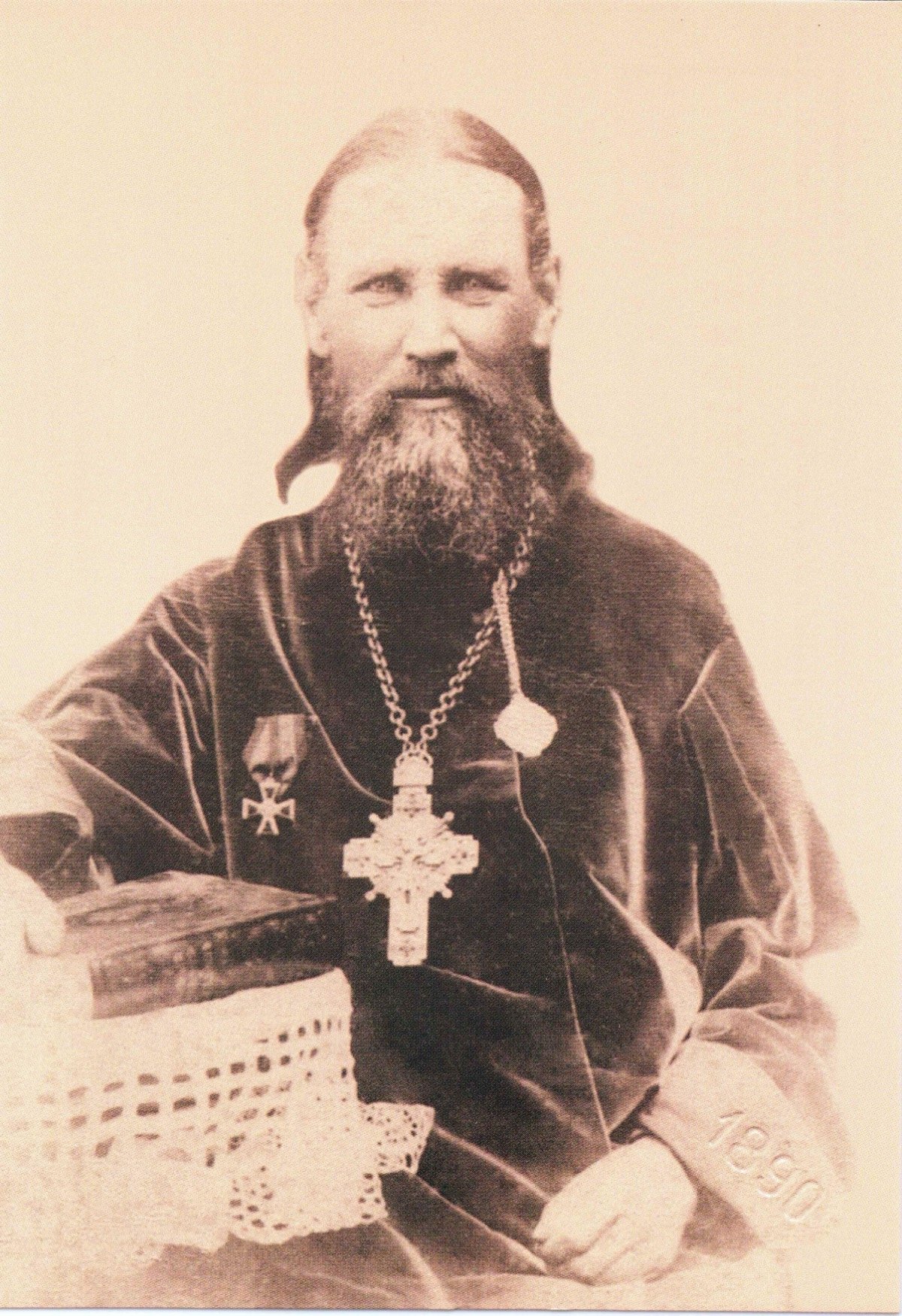 Photograph of St. John of Kronstadt in priestly vestments with a pectoral cross, taken in Kharkov in 1890