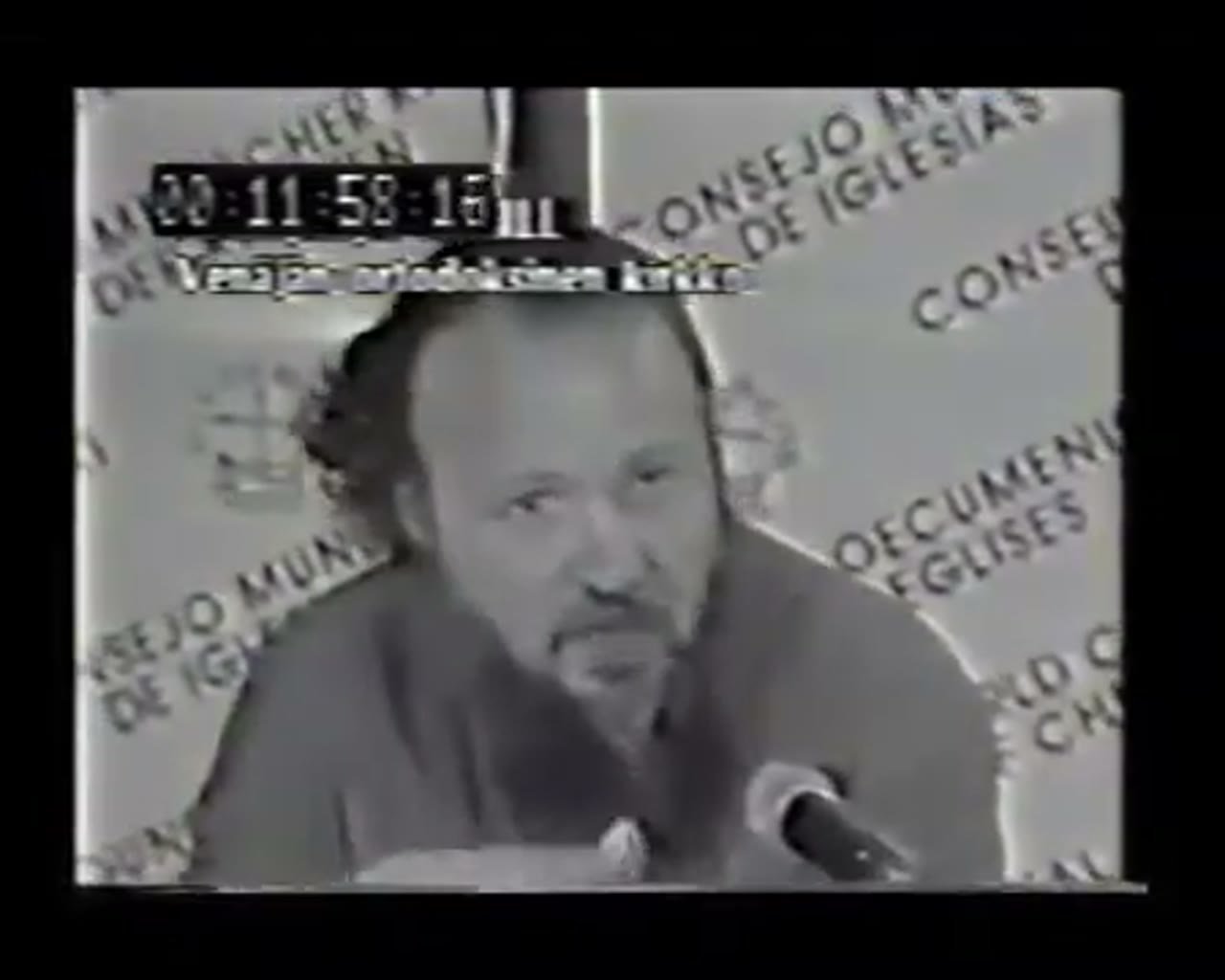 Archbishop Kirill Gundyaev at the microphone during the 7th WCC General Assembly in Canberra, February 1991, with the "Consejo Mundial de Iglesias" banner visible behind him