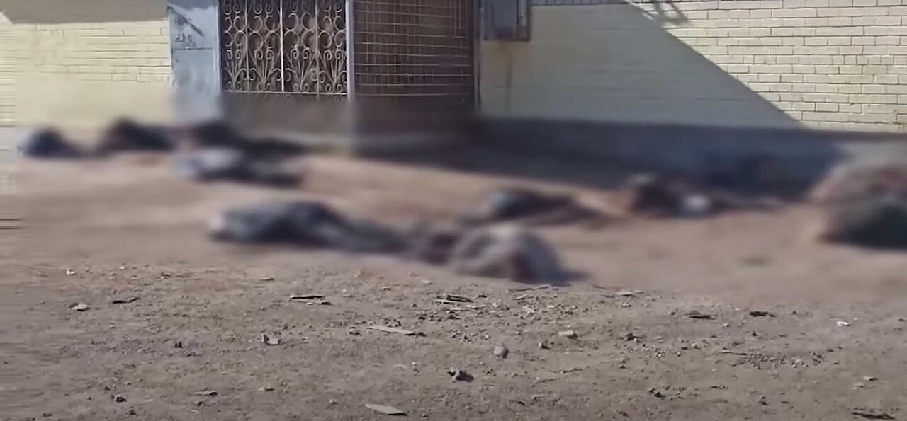 Aftermath of the Chernihiv breadline shelling, bodies on the ground outside a shop