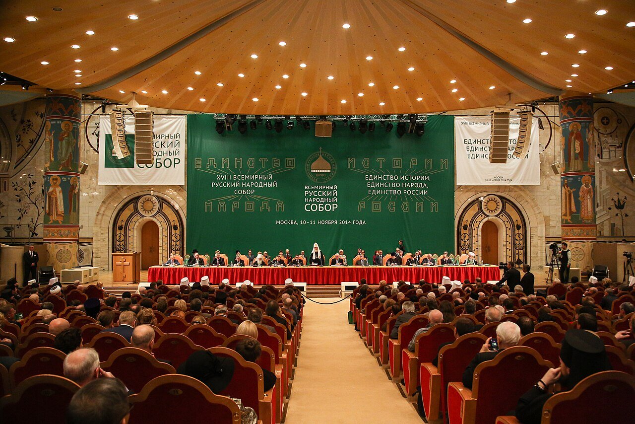 The XVIII World Russian People's Council in Moscow, November 2014, chaired by Patriarch Kirill. The banner reads "Unity of History, Unity of People, Unity of Russia."