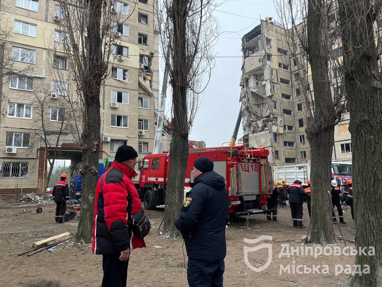 Dnipro apartment building in daylight, showing the collapsed center section