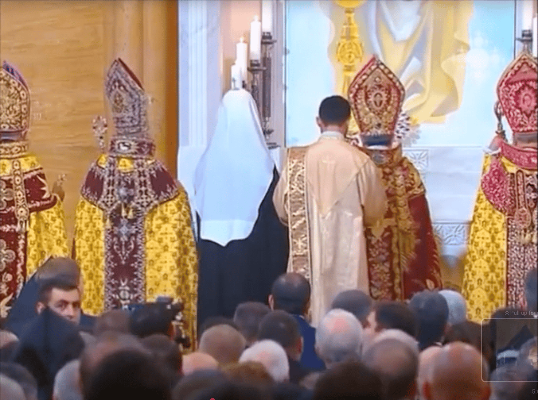 Kirill present during joint prayer, holding the cross