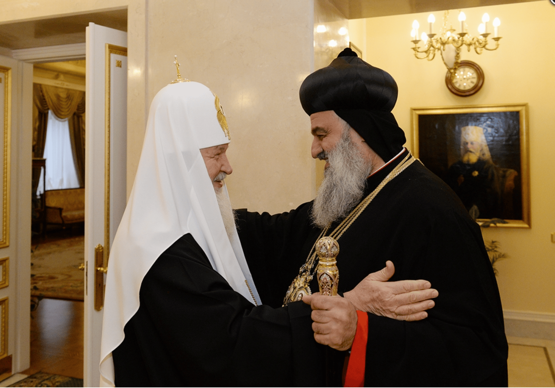 Patriarch Kirill in warm embrace with Syriac Orthodox Patriarch Ignatius Aphrem II