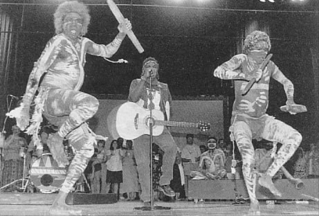 Aboriginal performers in body paint dance on stage during the opening ceremony of the WCC Seventh Assembly, Canberra, 1991.